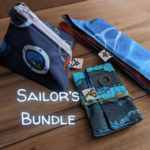 The Sailor's Bundle with the 5 inch Porthole Breach D4 bag, the Ominous sea utility roll, brass rope stacking ring, and the folded Wet Willy pocket tray with Sailor's Bundle written in glowing blue script.