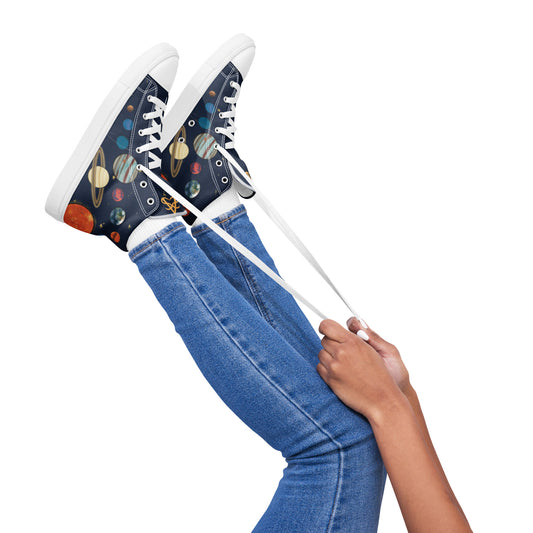A model wears a pair of high top shoes with our solar system and starry background on the sides.