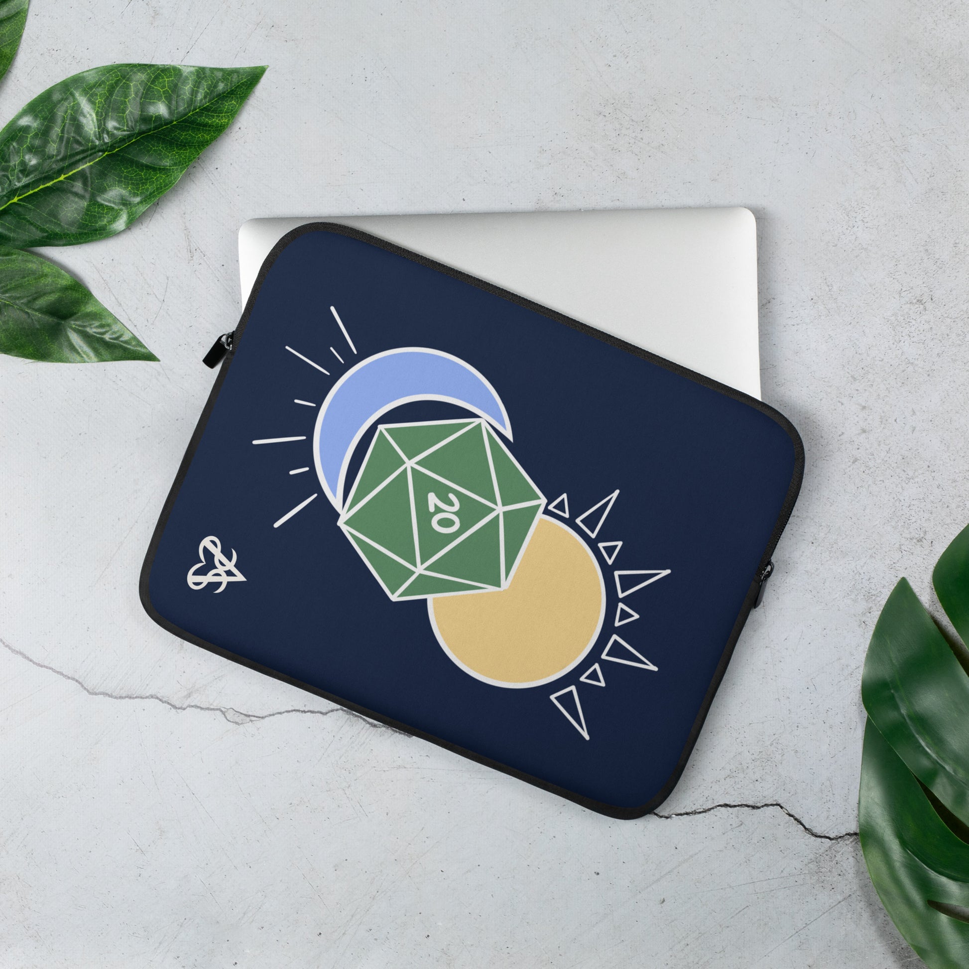 A laptop sleeve with an illustration of a D20 with a sun and moon on a midnight blue background.