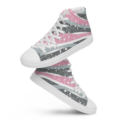 A pair of high top shoes with ribbons of the demigirl flag colors and stars coming from the heel and getting larger across the shoe to the laces.