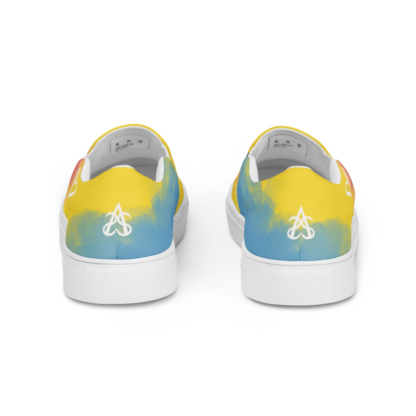 Back view: A pair of slip on shoes with color block pink, yellow, and blue clouds, a white hand drawn heart, and the Aras Sivad logo on the back.