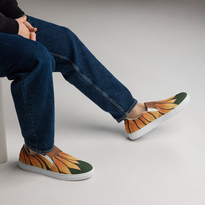 A model wears a pair of slip on shoes which are styled to look like sunflower petals are growing down from their ankle.