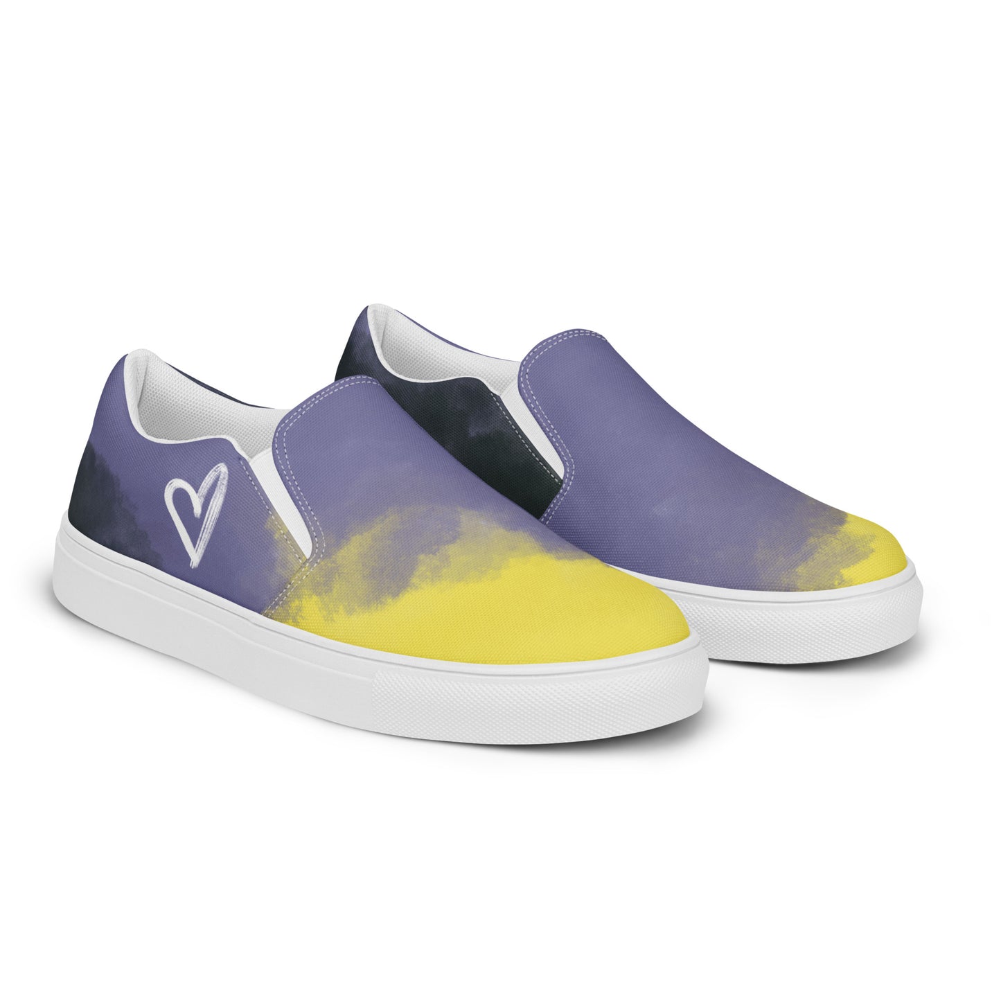 Right front view: pair of slip-on shoes with the non-binary colors in wisps of clouds with a white hand drawn heart on the outside under the ankle and the Aras Sivad Studio logo in white on the back.