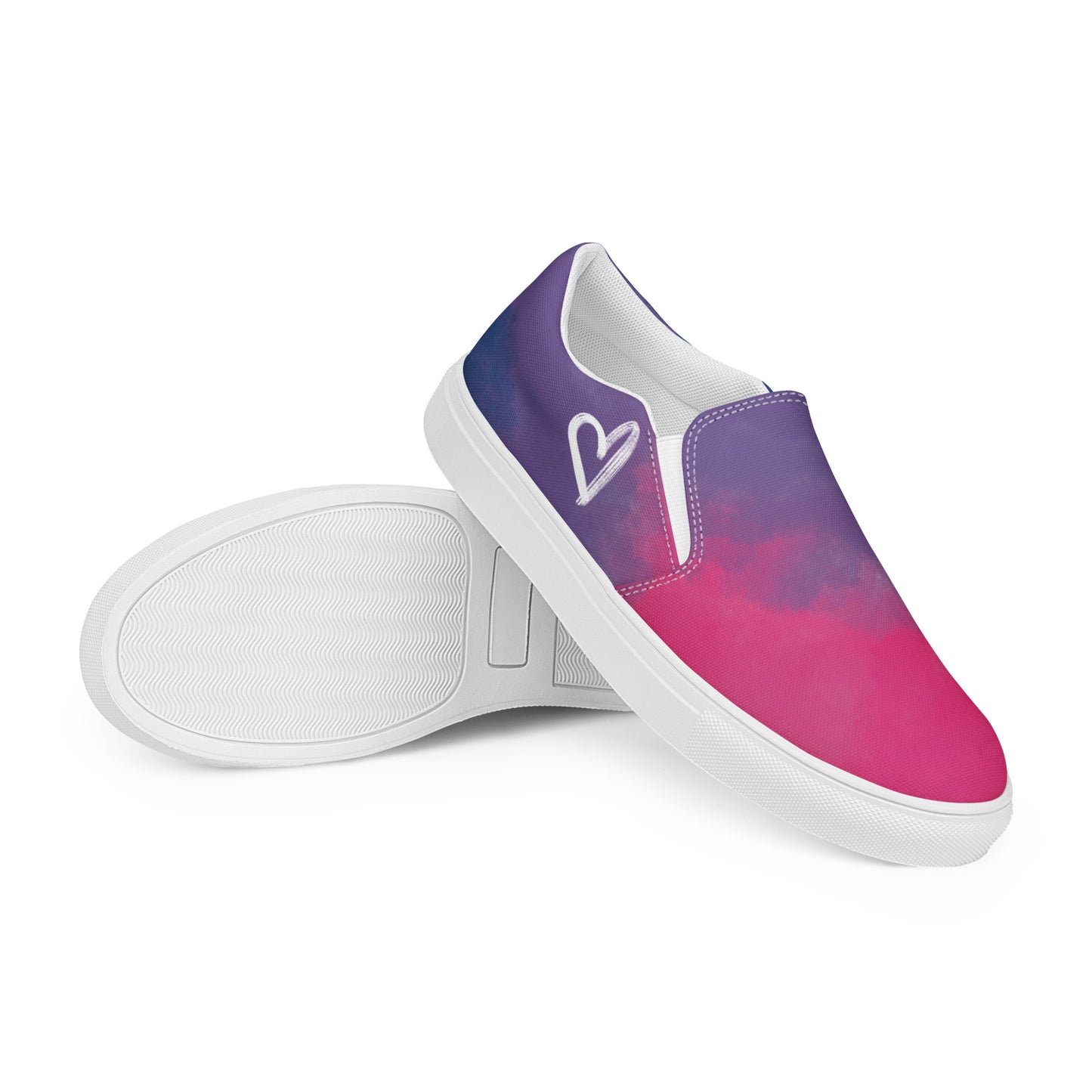 A pair of slip on shoes with color block pink, purple, and blue clouds, a white hand drawn heart, and the Aras Sivad logo on the back.