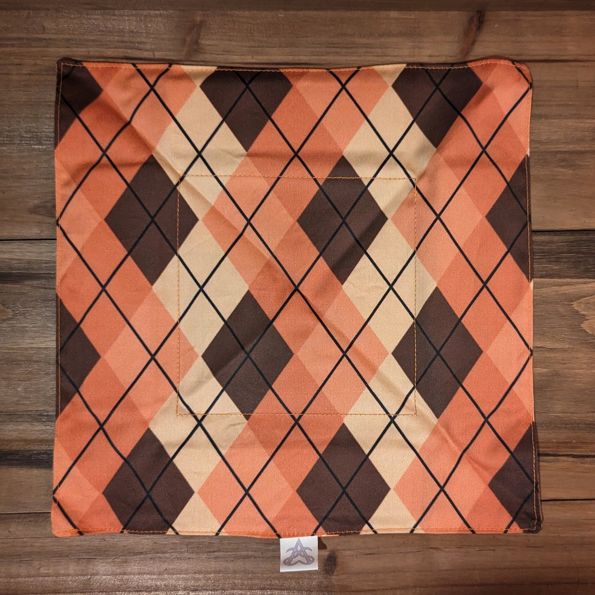 The Cozy Foxes tray laid flat to show the peach and brown argyle print side.