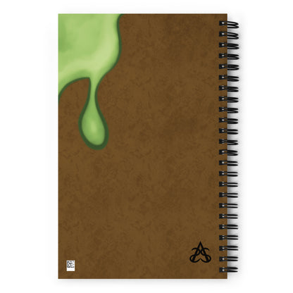 The back of the slimebook spiral notebook with the same slime illustration on brown texture print and the Aras Sivad Studio logo in the bottom right corner.