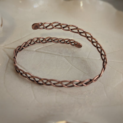 The other side of the copper braid bangle with Aras Sivad's stamp on one end and no stamp on the back of the other end.