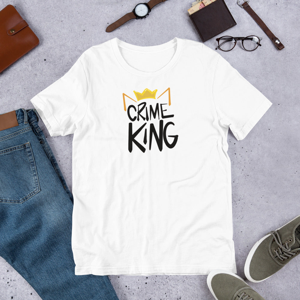 A white crew neck tee shirt has a pair of orange cat ears and yellow crown sitting on the words, "Crime King" in a bold writing.