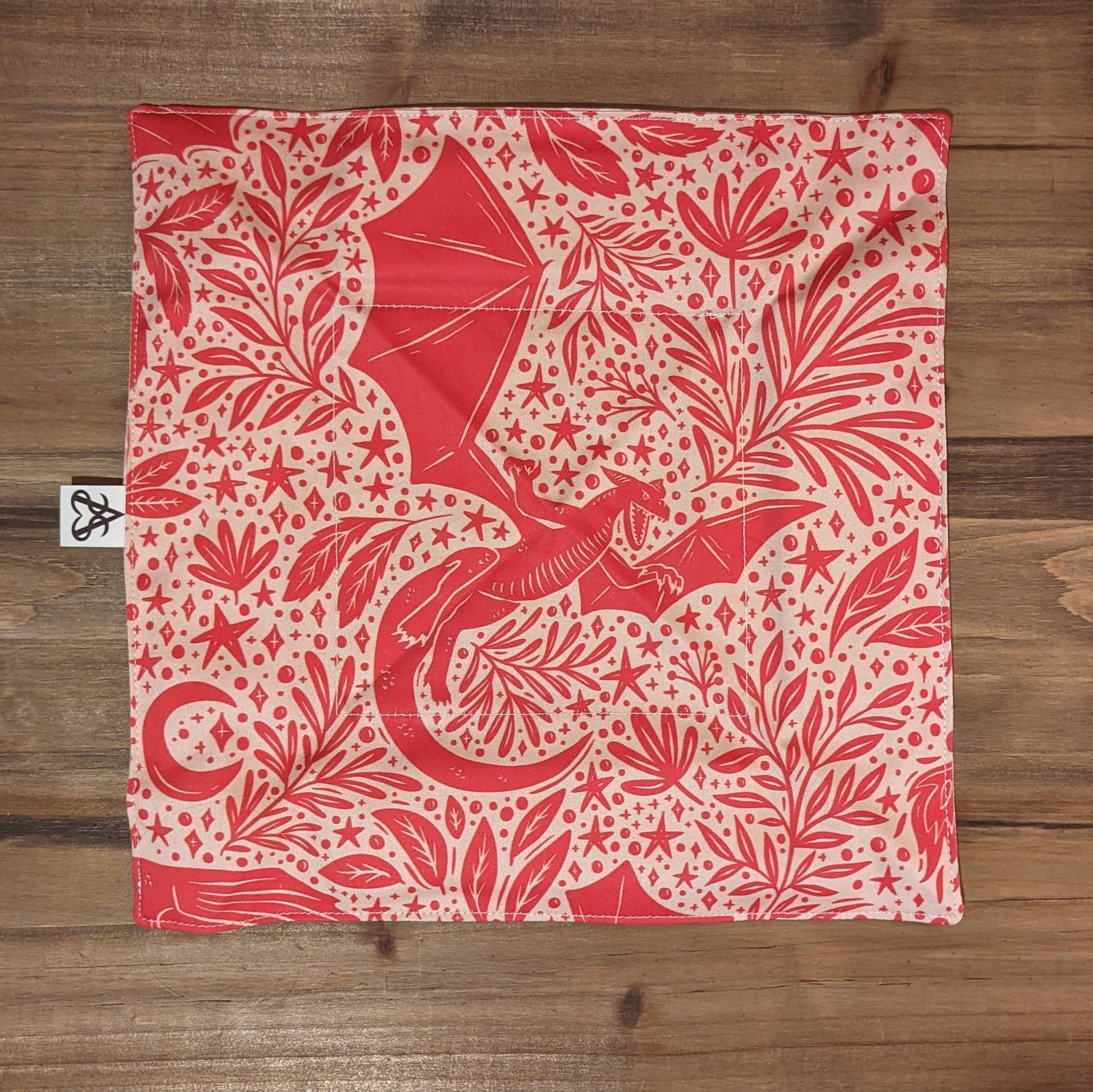 A view of the flat tray to show the vibrant dragon, botanical, and star design.