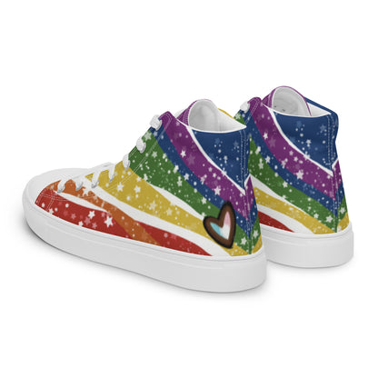 Left back view: A pair of high top shoes have wavy rainbow stripes coming from the heel and getting wider towards the laces, covered in stars, with a double heart in black and brown containing the Trans Pride flag near the heel.