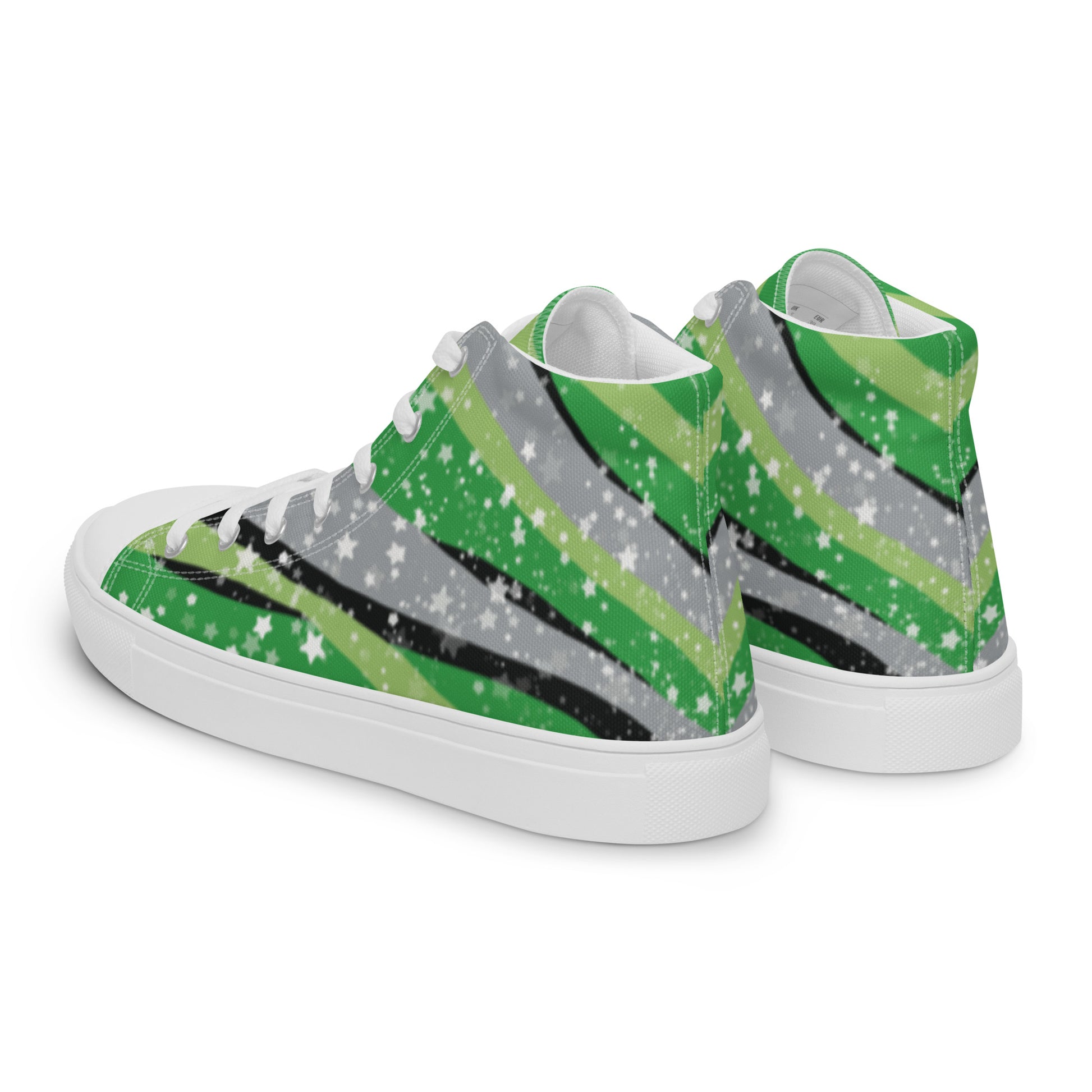Left back view: a pair of high-top shoes with ribbons of the greens, grey, and black of the aromantic pride flag coming from the heel and expanding towards the laces with an explosion of stars over it, white accents, and the Aras Sivad Studio logo in white on the tongue.
