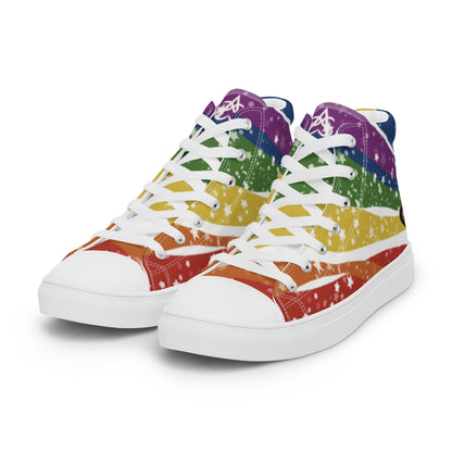 Left front view: A pair of high top shoes have wavy rainbow stripes coming from the heel and getting wider towards the laces, covered in stars, with a double heart in black and brown containing the Trans Pride flag near the heel.