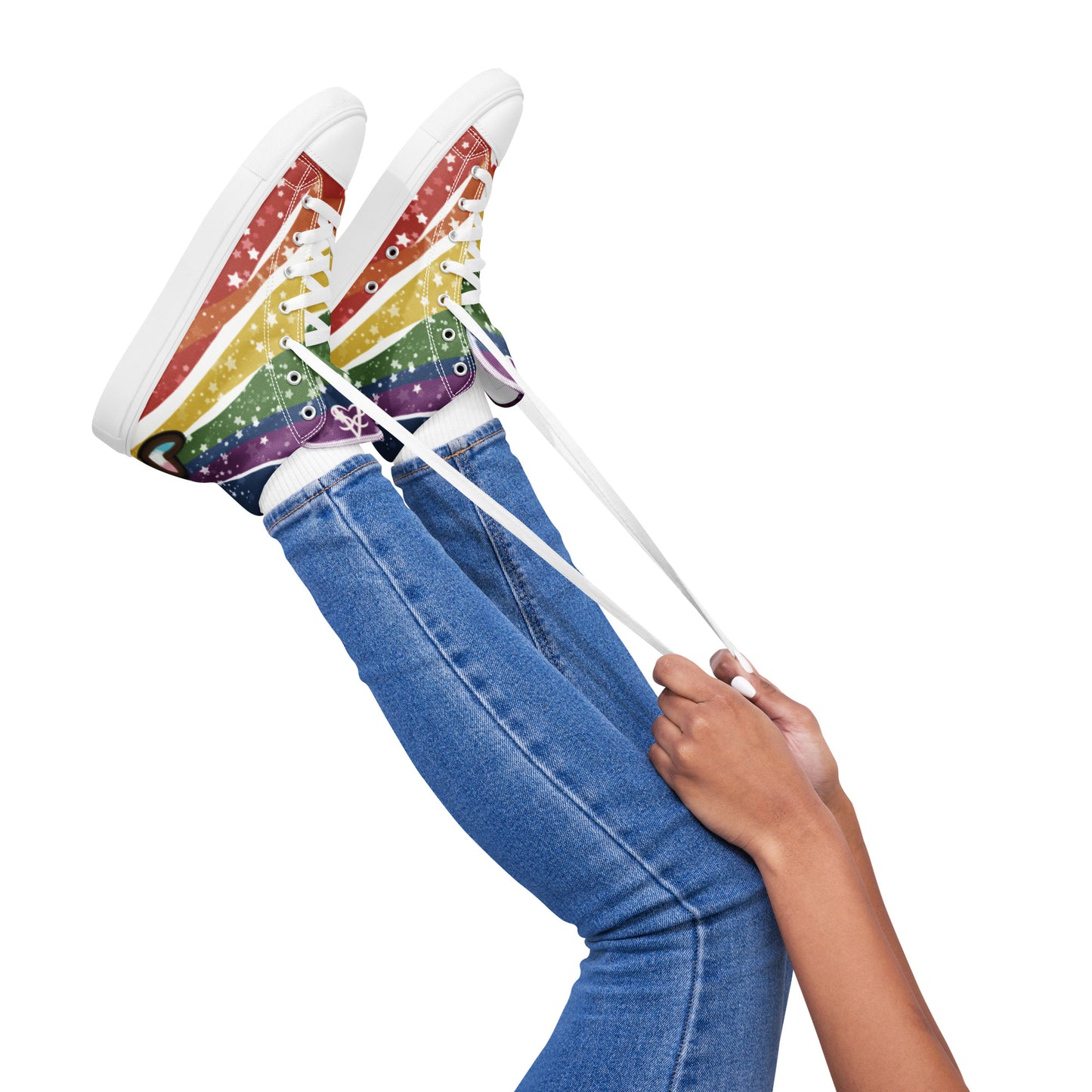 A model wears the Starry Rainbow pride high top shoes, waving them in the air and holding onto the laces.