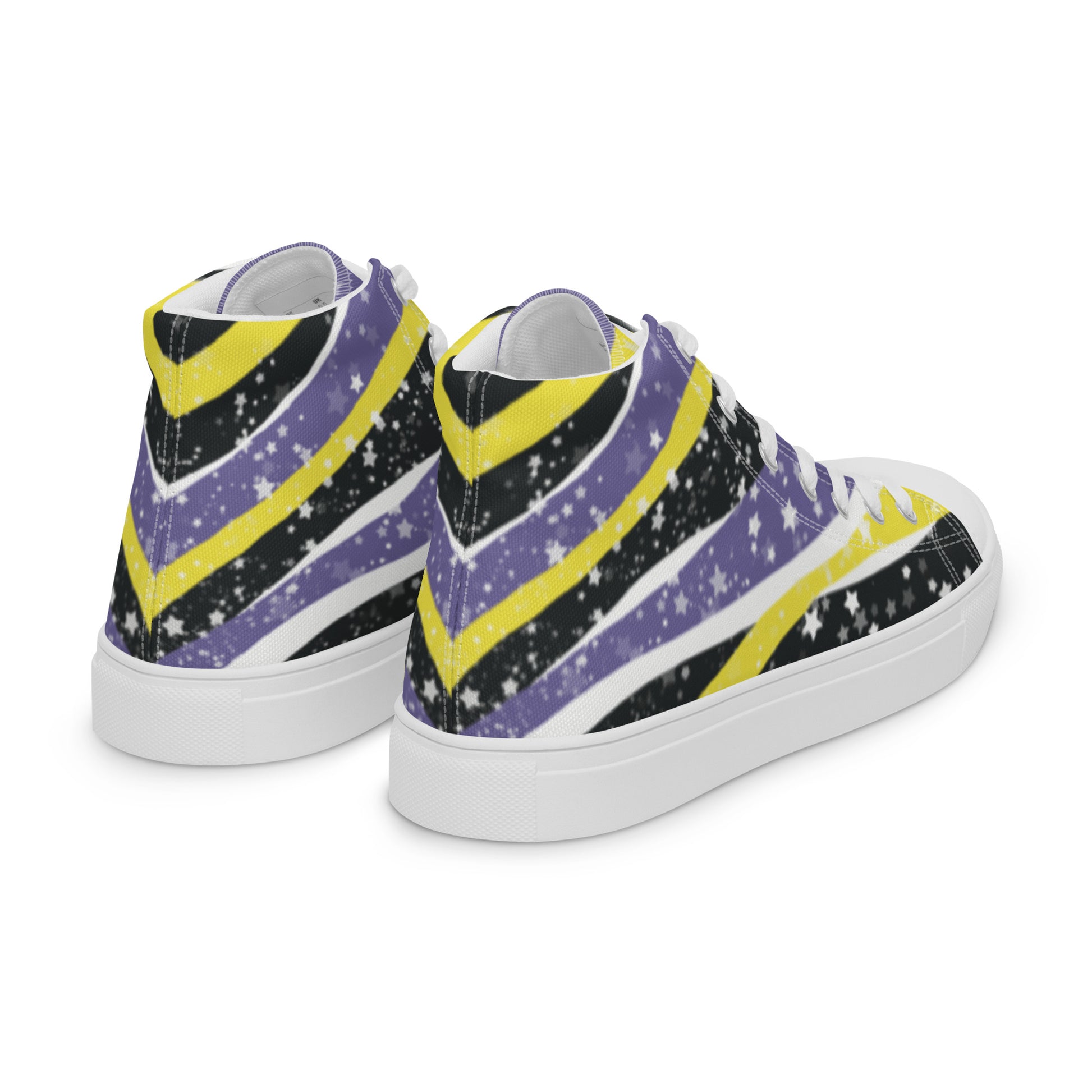 Right back view: a pair of high-top shoes with ribbons of the yellow, purple, and black of the non-binary pride flag coming from the heel and expanding towards the laces with an explosion of stars over it, white accents, and the Aras Sivad Studio logo in black on the tongue.