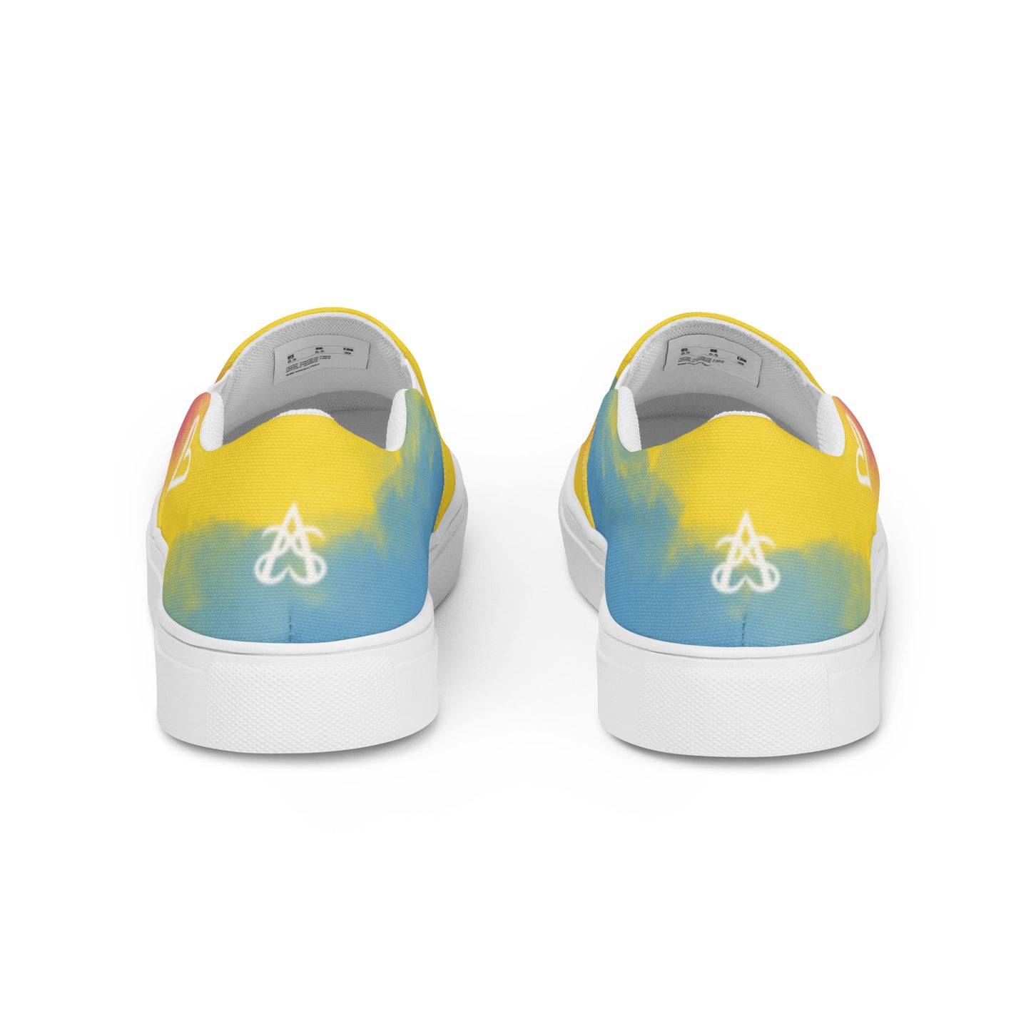 Back view: a pair of slip on shoes with color block pink, yellow, and blue clouds, a white hand drawn heart, and the Aras Sivad logo on the back.