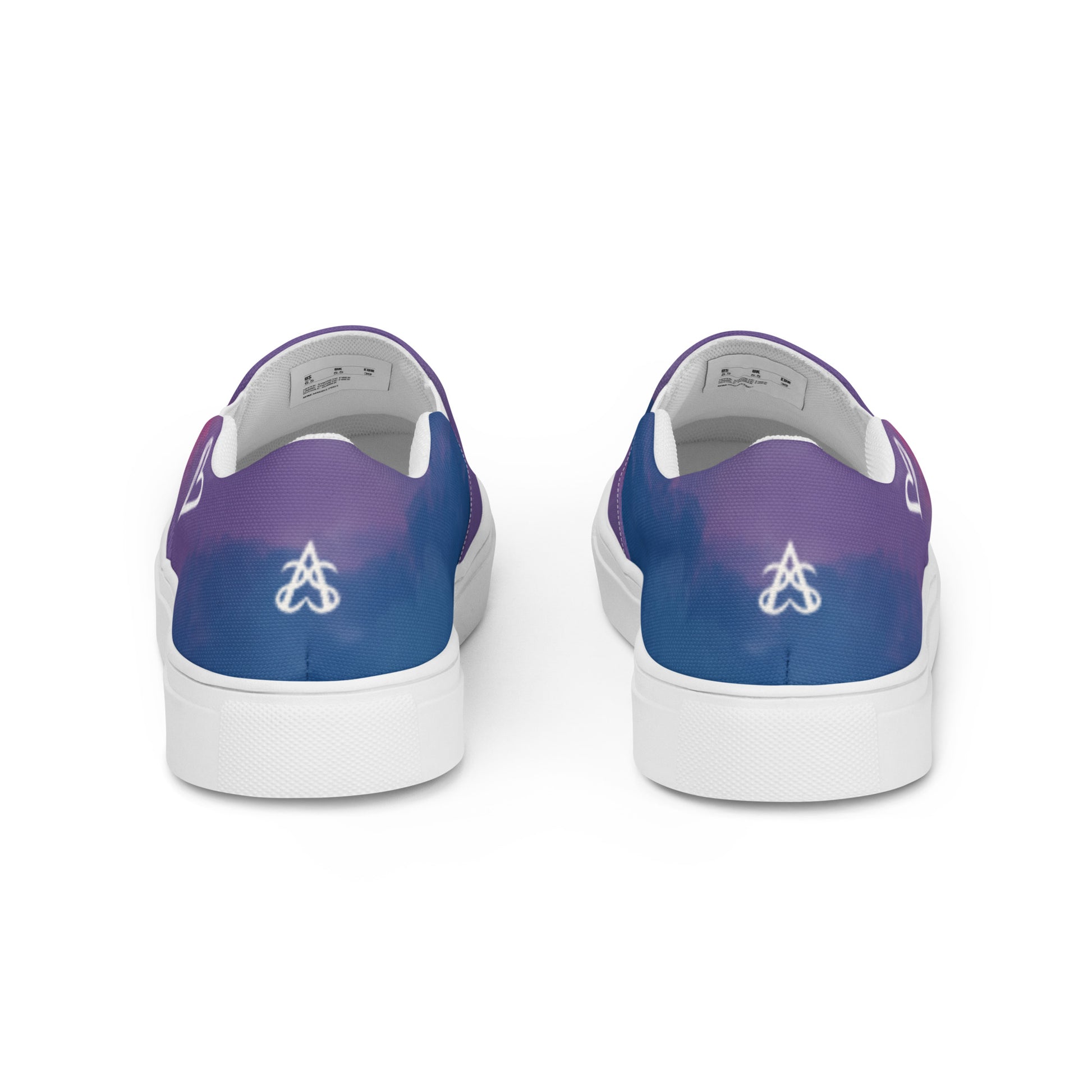Back view: a pair of slip on shoes with color block pink, purple, and blue clouds, a white hand drawn heart, and the Aras Sivad logo on the back.