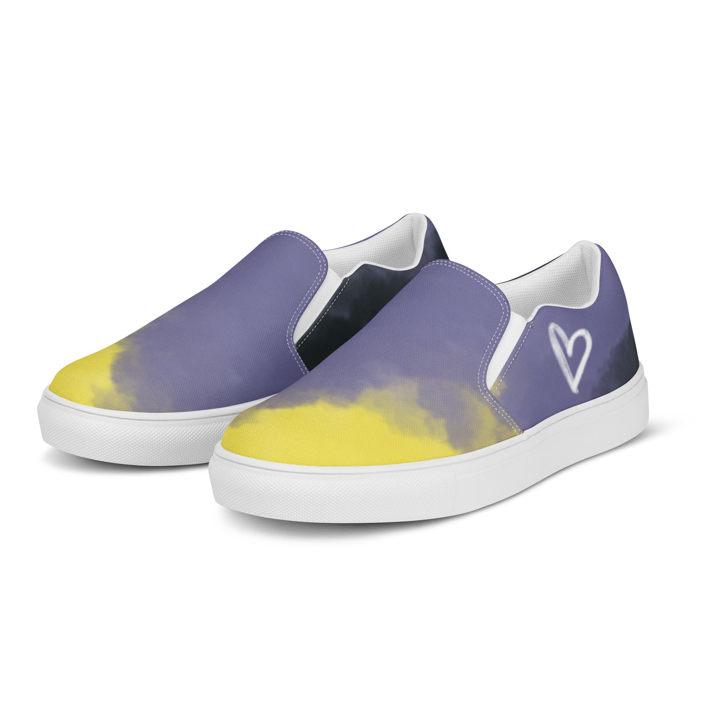 Left front view: A pair of slip-on shoes with the non-binary colors in wisps of clouds with a white hand drawn heart on the outside under the ankle and the Aras Sivad Studio logo in white on the back.