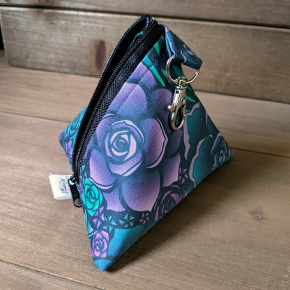 A D4 shaped bag with dark succulent print fabric sits on a wood surface.