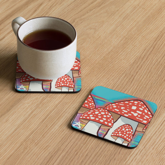 A coaster with a red spotted mushroom and rainbow illustration by Aras Sivad sits next to a second coaster with a mug on it.